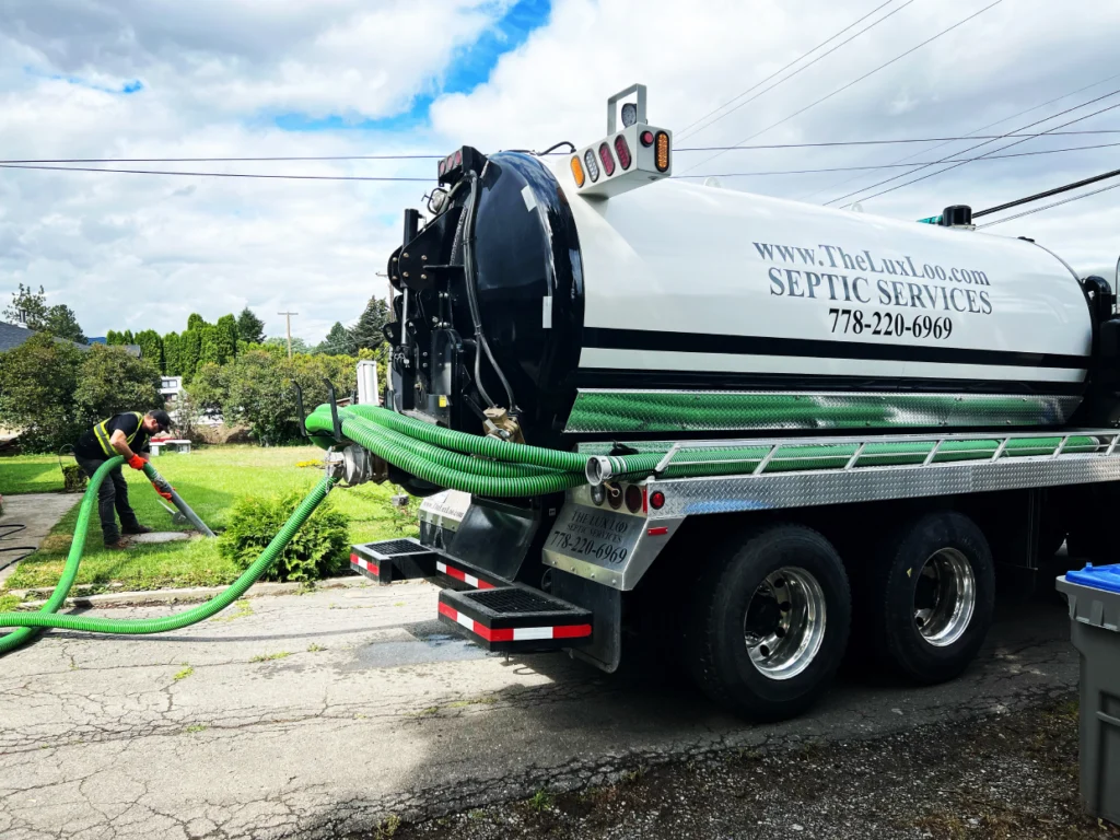 person pumping septic system