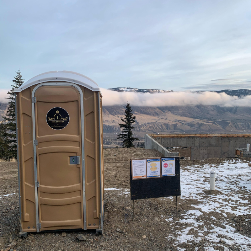 WorkSafeBC compliant flushable toilet trailer on a Kamloops BC construction site in winter