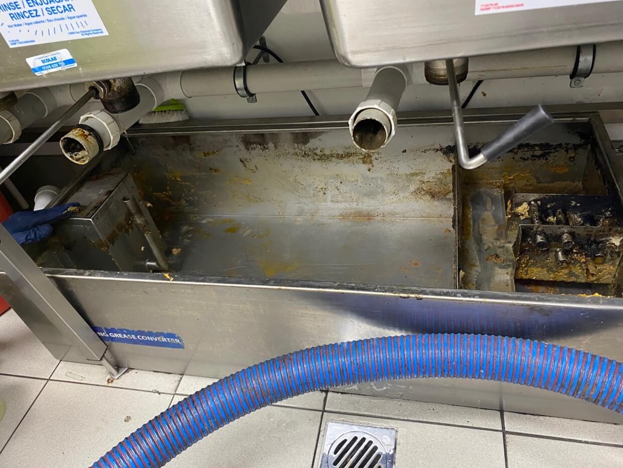 grease trap pump-out service being performed at a commercial kitchen in Kamloops BC