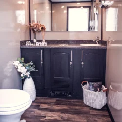 interior of luxury washroom trailer rental showing vanity and lighting for BC outdoor event
