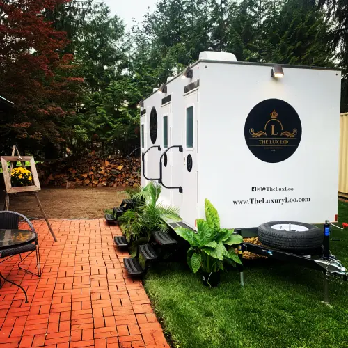 The Lux Loo washroom trailer set up at an outdoor event